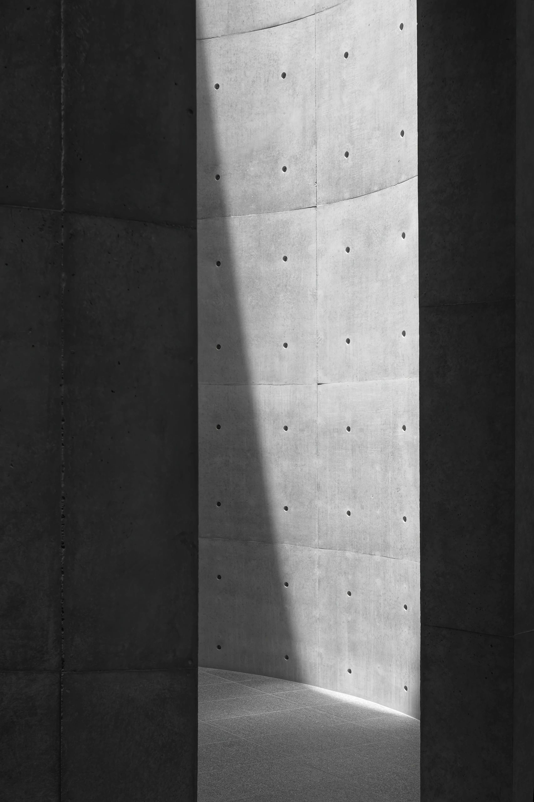 Abstract concrete structure with shifting light and shadow