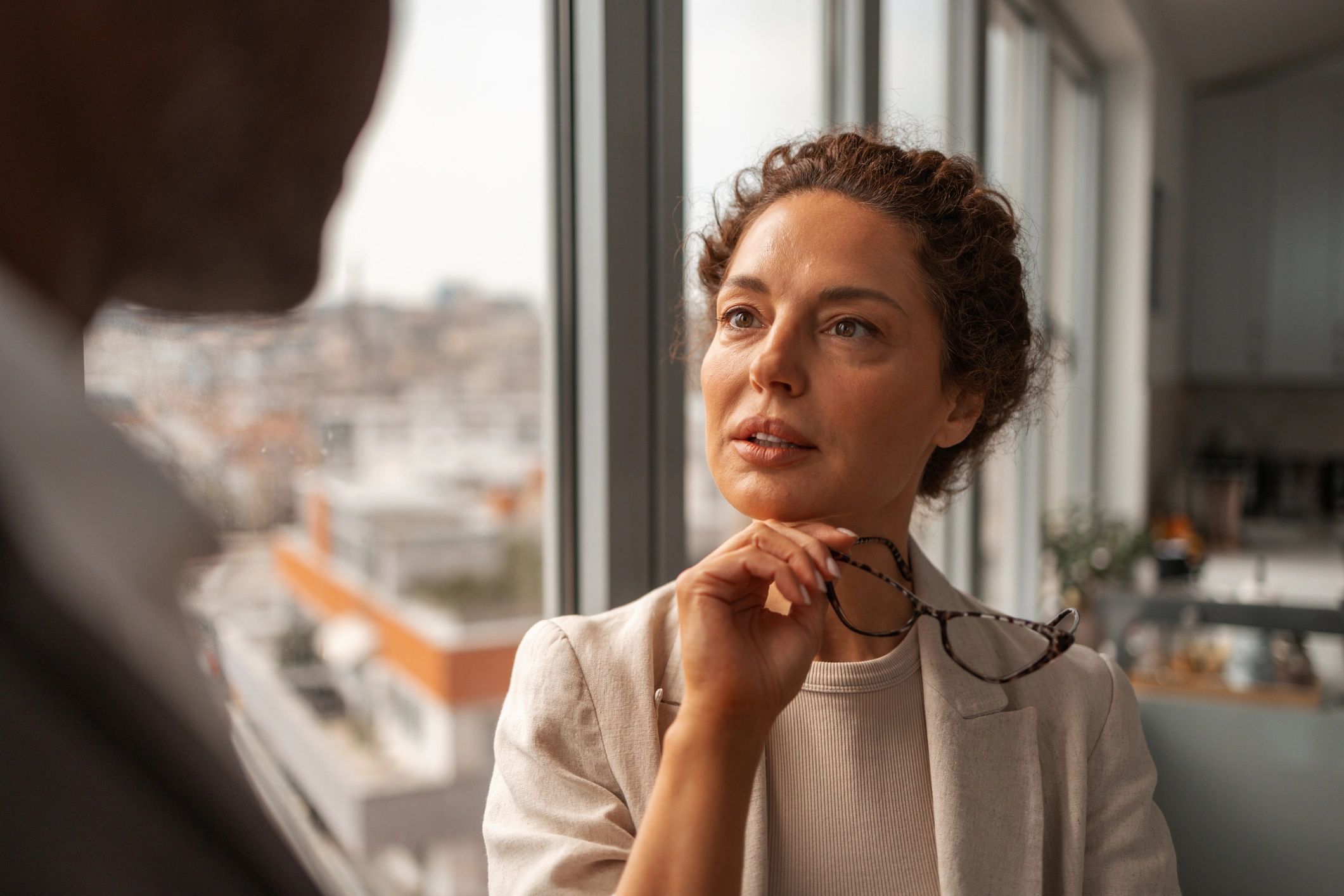 Two professionals in a thoughtful, candid leadership conversation