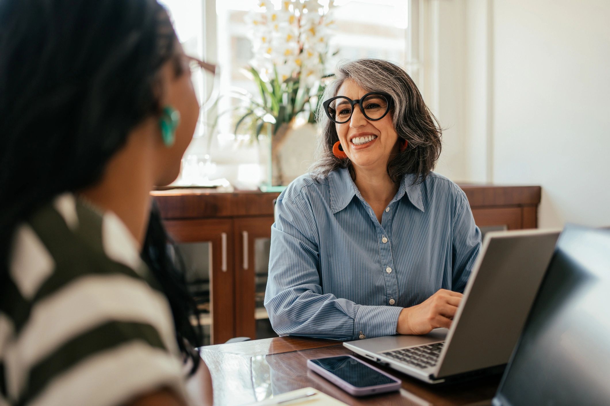 Senior leader in conversation with a colleague